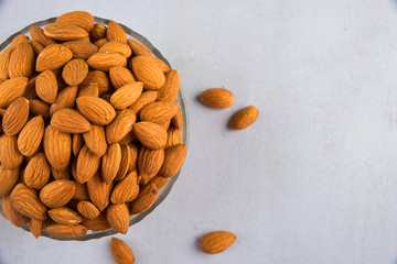 Almond In A Bowl On Grey Background