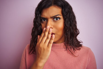 Young beautiful transsexual transgender woman standing over isolated pink background cover mouth with hand shocked with shame for mistake, expression of fear, scared in silence, secret concept