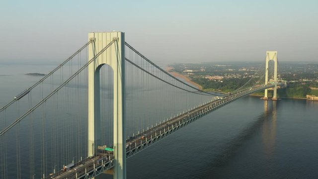 High, descending, rotating, aerial of both Verrazano Bridge arches; buttery smooth;4k; cinematic