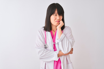 Young beautiful chinese doctor woman wearing stethoscope over isolated white background looking stressed and nervous with hands on mouth biting nails. Anxiety problem.