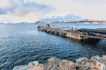 Fototapeta na wymiar Sea boat pier in the north Norwegian town Kirkenes