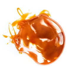 Caramel sauce drop isolated on a white background close up..Sweet caramel