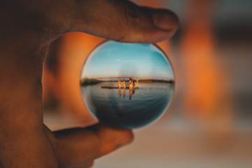 bathing children are reflected in a crystal ball