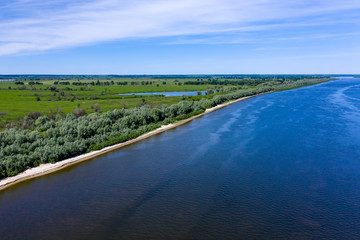 Forest and beach by the river. Aerial drone shot