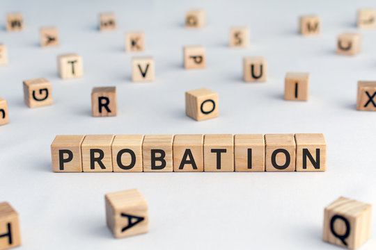probation - word from wooden blocks with letters, time criminal is allowed to stay out of prison or period a new employee is suitable for work concept, random letters around, white  background