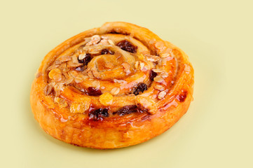 Freshly Baked Traditional Sweet Cinnamon Rolls, Swirl on yellow board.