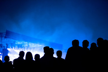 Fototapeta premium Silhouette of concert crowd and stage lights
