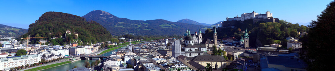 Fototapeta na wymiar Panoramic view of the city of Salzburg on a summer day, view of the hill of the castle and the river, Salzburg, Austria.