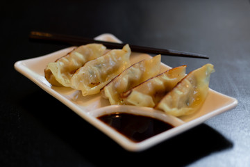 Japanese gyoza or dumplings snack with soy sauce