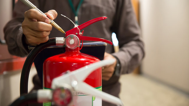 Fire extinguishers, Engineers are checking fire extinguishers.