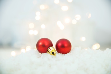 Red Christmas Balls On Snow With Glittering Background