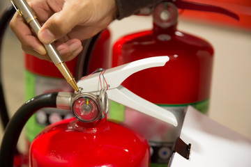 Fire extinguishers, Engineers are checking fire extinguishers.