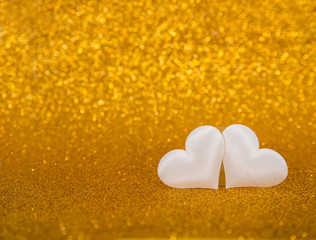 Two White Hearts with Glitter Background