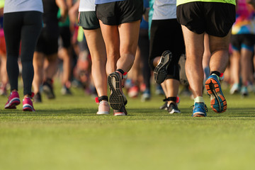 Marathon running race, people run feet on the lawn
