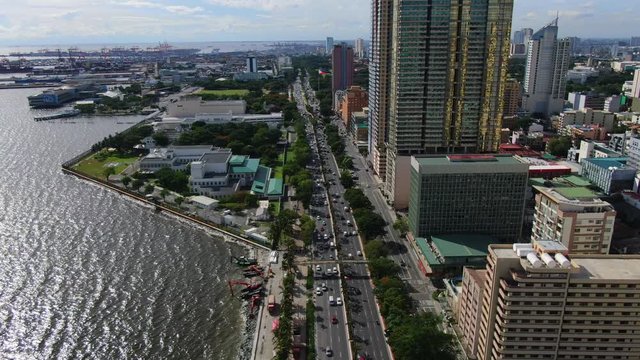 Flying over Roxas Boulevard and Manila Bay from Philippines.