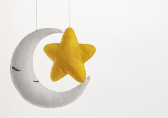 Colorful and eco-friendly children's mobile from felt. On white background.