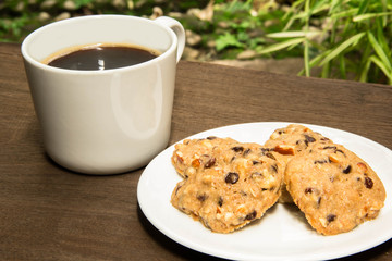 Cup of coffee and chocolate cookies