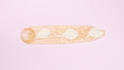 Top view condom with spermatozoa inside