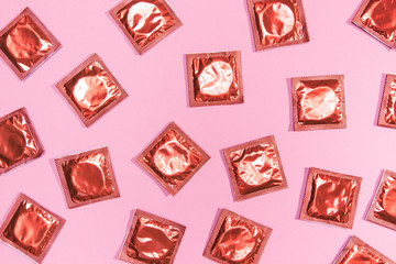 Top view condoms in red wrappers