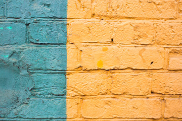 Brick wall in yellow and green. Stripes up. A place for your design