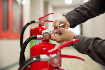 Fire extinguishers, Engineers are checking fire extinguishers.