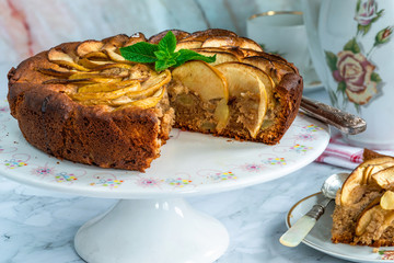 Apple, ginger and honey cake garnished with fresh mint