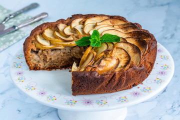 Apple, ginger and honey cake garnished with fresh mint