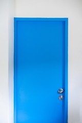 Minimalist clean blue door with Grey wall. Minimalist interior concept.