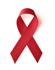 AIDS awareness red ribbon on white background