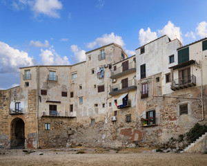 Fototapeta na wymiar Beautiful view of town Cefalu in Sicily island, Italy. Sicilian houses and buildings on coast Tyrrhenian Sea.