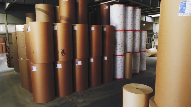 packaging paper and sticker rolls in large warehouse