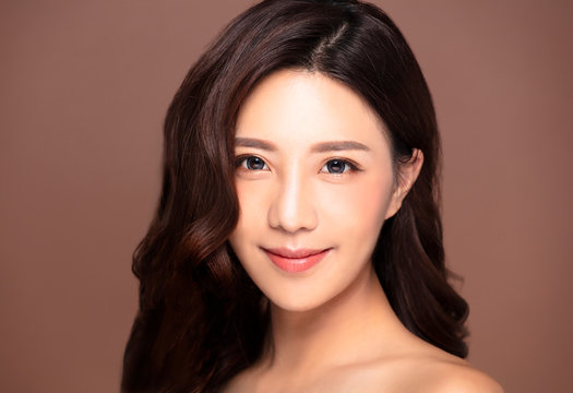 Beautiful young woman with natural makeup and clean skin