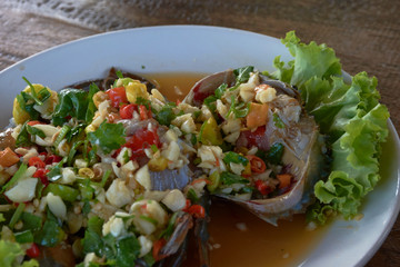 raw mud-crab in fish sauce and Thai recipe spicy sauce topping.