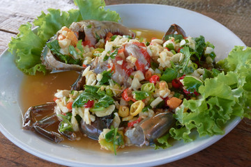 raw mud-crab in fish sauce and Thai recipe spicy sauce topping.