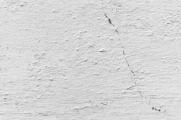 Texture of a concrete wall with cracks and scratches which can be used as a background