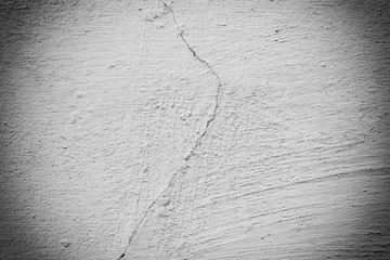 Texture of a concrete wall with cracks and scratches which can be used as a background