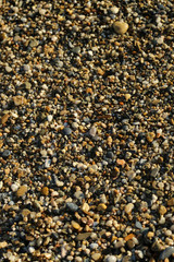 Small sea stones, stones on the beach, vacation at sea, pebbles seashore. Background. Texture.