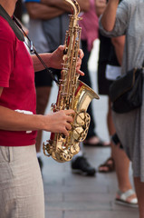 Obraz premium closeup of saxophonist playing in the street