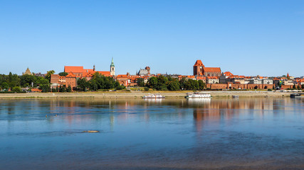 Fototapeta na wymiar Panoramic view of Torun city and Wisla (Vistula) river in sunny day. Poland, summer 2019