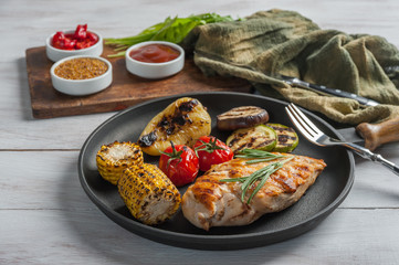 Fried chicken fillet and boiled vegetables