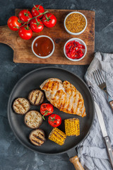 Fried chicken fillet and boiled vegetables