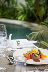 Fototapeta premium Beefsteak served with steamed vegetables, Exquisite dish, creative restaurant meal concept 
