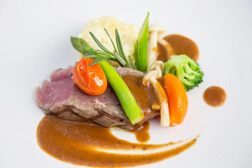 Beefsteak served with steamed vegetables, Exquisite dish, creative restaurant meal concept