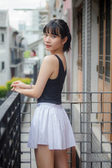 Portrait of thai adult beautiful girl black shirt white skirt relax time