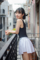 Portrait of thai adult beautiful girl black shirt white skirt relax time