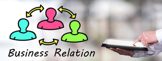 Business relation concept with man using a tablet