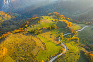 Idyllic aerial drone shot of autumn countryside hills