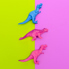 Fototapeta na wymiar Set Dinosaurs toys on a colored background. Flat lay minimal art