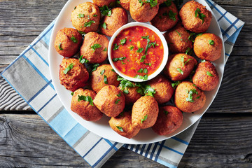 Plantain fritters Klako on a white plate © myviewpoint