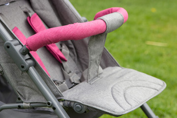 baby stroller close up,baby stroller closeup gray color on grass
